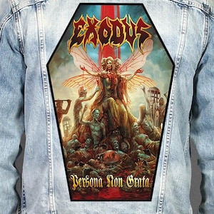May include: A light blue denim jacket featuring a large, coffin-shaped back patch with a graphic illustration. The artwork displays the text Exodus at the top and Persona Non Grata at the bottom, surrounding a central winged figure and zombies.