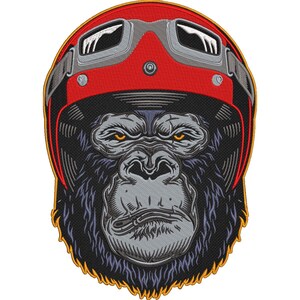May include: Embroidered patch featuring a gorilla wearing a red motorcycle helmet with silver goggles. The gorilla has a stern expression with yellow eyes and a gray face. The patch has a black background and a gold border.