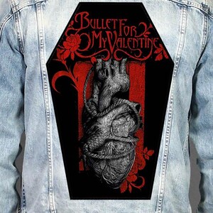 May include: A light blue denim jacket featuring a large, coffin-shaped back patch. The patch displays a black background with a grey anatomical heart wrapped in rope, red roses, and the text Bullet For My Valentine in a stylised red font.