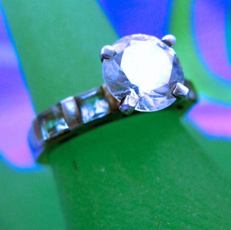 Size 7 Ring Engagement Cubic Zirconia and 4 Blue Topaz Baguettes Marked QJ 925 99.08