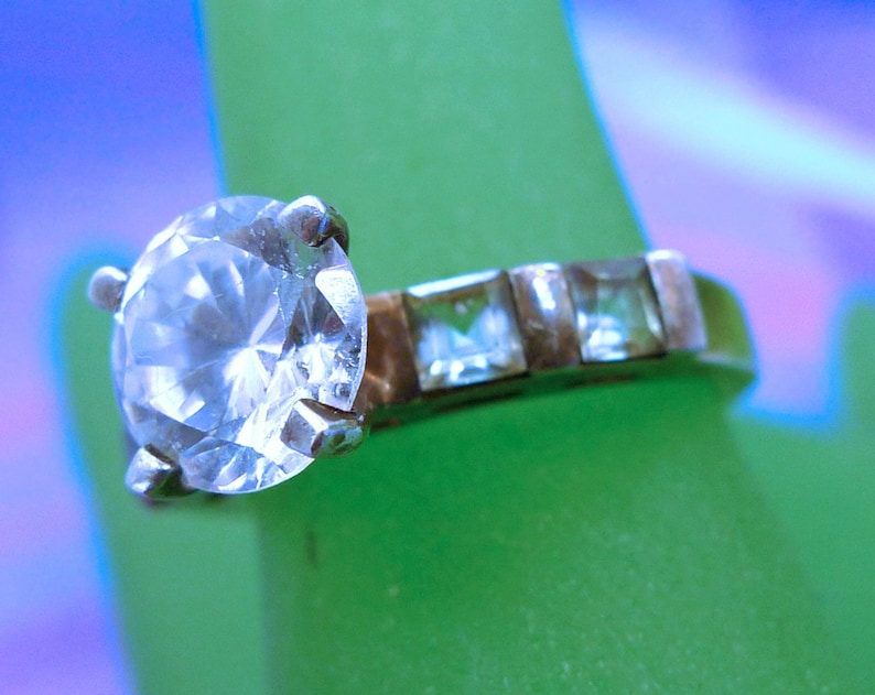 Size 7 Ring Engagement Cubic Zirconia and 4 Blue Topaz Baguettes Marked QJ 925 99.08