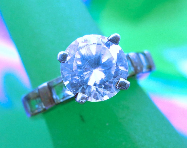 Size 7 Ring Engagement Cubic Zirconia and 4 Blue Topaz Baguettes Marked QJ 925 99.08
