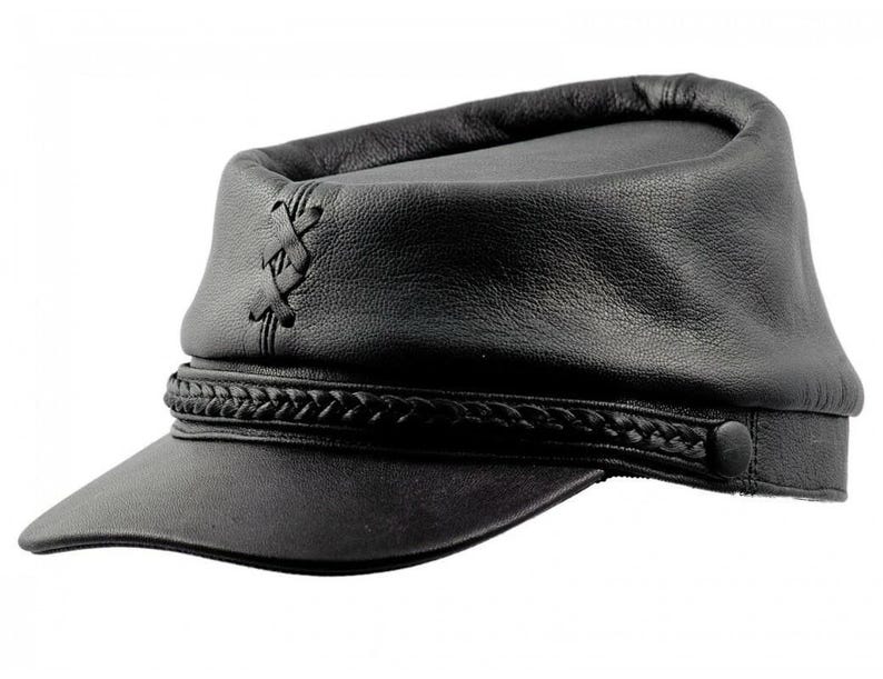 May include: Black leather cap with a short brim and a braided band. The cap features decorative stitching on the side and a button detail. The hat has a classic, military-inspired design.