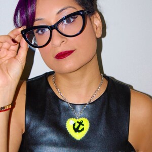 Large Bright Yellow Glitter Heart Necklace with a Black Anchor Embellishment & White Rose