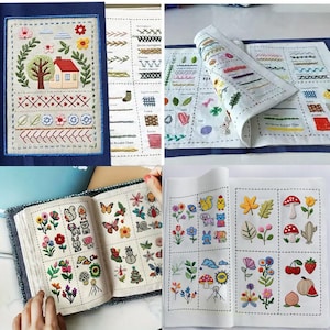 May include: A collection of embroidered textile art pieces. One piece features a house, tree, and floral elements. Other pieces showcase various embroidery stitches and floral, animal, and nature-themed designs. The pieces are displayed on a blue surface.