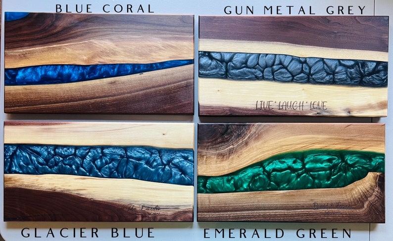 May include: Four wooden cutting boards with a river of epoxy resin in different colors. The colors are blue coral, gun metal grey, glacier blue, and emerald green. The boards are all made of walnut wood and have a natural finish. The boards are all approximately 12 inches long and 6 inches wide.