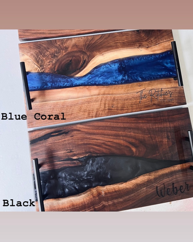 May include: Two wooden serving trays with black resin inlays. The top tray has a blue resin inlay and the text "The Ritchie's Est. 2003". The bottom tray has a black resin inlay and the text "Weber".