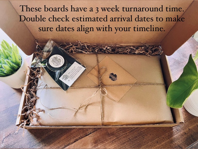 May include: A brown cardboard box with a brown paper wrapped package inside. The box is open and the package is visible. The package is tied with twine and has a small brown envelope on top. The box is filled with brown packing peanuts.