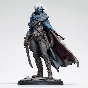 May include: A fantasy figurine of a dark-skinned elf with white hair, wearing a blue hooded cloak, dark trousers, and leather-like boots. The character holds a curved blade in one hand and stands on a circular base with a stone-like texture.