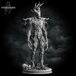 May include: A grayscale sculpture of a humanoid figure with a tree-like appearance. The figure has a detailed, textured surface resembling bark and branches. The sculpture stands on a circular base with the "STORMBORN COLLECTIBLES" logo in the upper left corner.