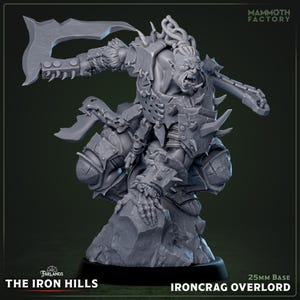 May include: A grey miniature figure of an Orc, the Ironcrag Overlord, from The Iron Hills. The figure is posed with a large axe and is heavily armored with spikes. The base is 25mm. The Mammoth Factory logo is visible.