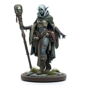 May include: A detailed figurine of a grey-skinned elf with long white hair, wearing a tattered olive green cloak and leather gear. The figure holds a tall staff topped with a skull encased in a glass cube and stands on a circular base.