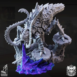 May include: A grey, unpainted resin miniature of a multi-legged, armoured creature with a spiked back and long antennae. The creature is positioned on a rocky base and is depicted spewing a vibrant purple, liquid-like substance from its mouth.