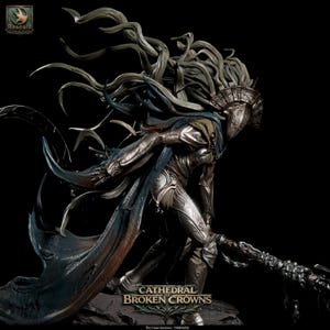 May include: A detailed figurine of a warrior in silver armor with a flowing cape and long, wind-swept hair. The figure wears a metallic crown and holds a textured staff. Text at the bottom reads CATHEDRAL OF BROKEN CROWNS and THE CROWN HUNTRESS.