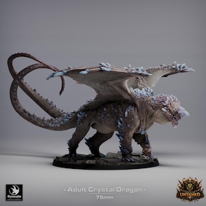 May include: A detailed figurine of an Adult Crystal Dragon, with a brown body and blue crystal accents. The dragon has large wings and a long tail. The base is approximately 7.6 cm in diameter. The text on the base reads "Adult Crystal Dragon - 75mm".