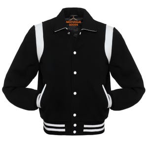 May include: Black varsity jacket with white accents. The jacket features white stripes on the shoulders, pockets, and hem. The jacket has a button-up front and a collar. The tag reads NESTVOGUE GOODS.
