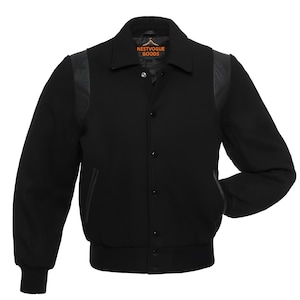 May include: Black varsity jacket with leather accents on the shoulders and pockets. The jacket has a button-up front, a ribbed hem and cuffs, and a collar. The brand name "NESTVOGUE GOODS" is visible on the collar.