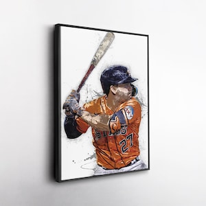 May include: A framed art print of a baseball player in an orange uniform with the number 27. The player is holding a baseball bat, ready to swing. The artwork has a watercolor effect with splashes of paint.