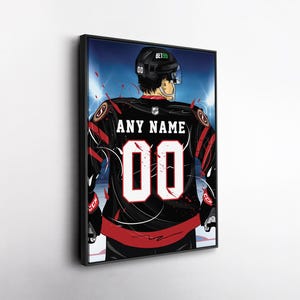 May include: Framed artwork of a hockey player in a black and red jersey with the number 00. The jersey has the text "ANY NAME" above the number. The player is wearing a black helmet with the text "BET99". The background is a hockey rink.