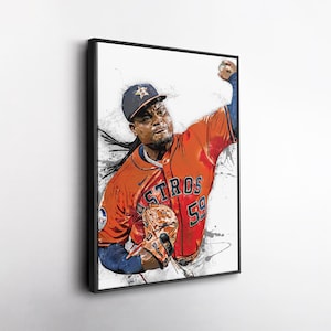 May include: Framed artwork featuring a baseball player in an orange jersey with the word "ASTROS" and the number "59". The player is in mid-pitch, with a baseball in hand. The artwork has a sketch-like style with black and white accents.