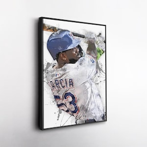 May include: Framed art print of a baseball player mid-swing. The player wears a blue helmet and a white jersey with the name "GARCIA" and the number "53" in blue. The artwork has a watercolor effect with black paint splatters.