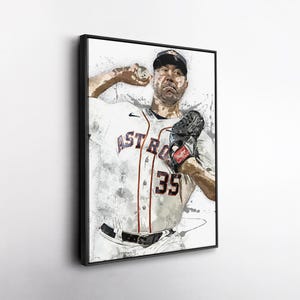 May include: A framed watercolor-style print of a baseball pitcher in action. The pitcher is wearing a white jersey with "ASTROS" and the number "35" in orange and black. He's wearing a black cap and glove, with a baseball in his hand.