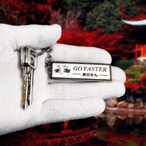 Jdm &quot;go faster daddy&quot; anime keychain - premium stainless steel car accessory for japanese car enthusiasts - gift for anime & jdm lovers