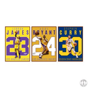 May include: Three framed basketball player prints. LeBron James in a yellow and purple jersey with the number 23, Kobe Bryant in a yellow and purple jersey with the number 24, and Stephen Curry in a blue and yellow jersey with the number 30.