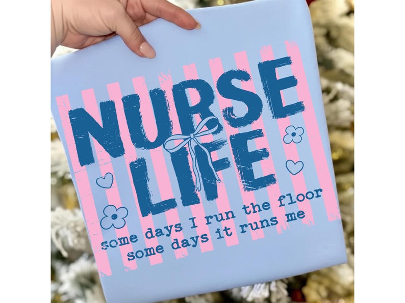May include: A light blue square with the words "NURSE LIFE" in dark blue, with a bow, flowers, and hearts. Pink and white vertical stripes are behind the text. The text "some days I run the floor some days it runs me" is at the bottom.