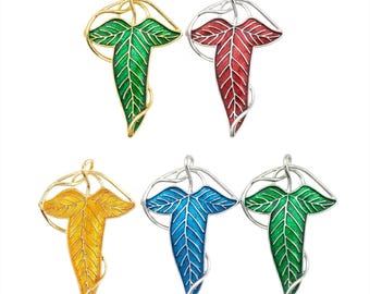 Groen emaille klimopbladspeld: zilveren elfenbroche