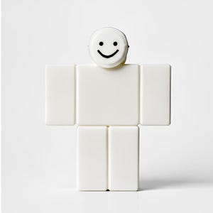 May include: A white, block-shaped figure with a smiling face on top. The figure is composed of rectangular blocks, resembling a simplified human form. The head is a small, round shape with a black, curved smile.