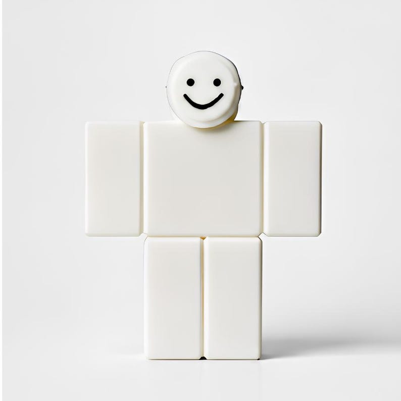 Puede incluir: Una figura blanca en forma de bloque con una cara sonriente en la parte superior. La figura est&aacute; compuesta por bloques rectangulares, que se asemejan a una forma humana simplificada. La cabeza es una forma peque&ntilde;a y redonda con una sonrisa negra curvada.