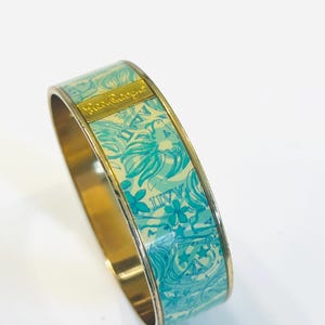 May include: A set of three ceramic mugs with a speckled, matte finish. Each mug features a different color: light blue, cream, and gray. The mugs have a simple, modern design and a comfortable handle. Perfect for coffee or tea.