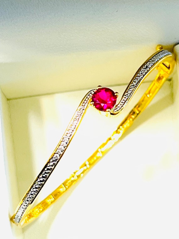 Elegant created ruby bangle bracelet - image 1