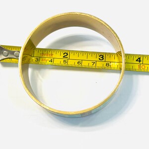 May include: A set of three ceramic mugs with a speckled, matte finish. The mugs are in shades of cream, light gray, and dark gray. Each mug has a simple, minimalist design, perfect for coffee or tea.