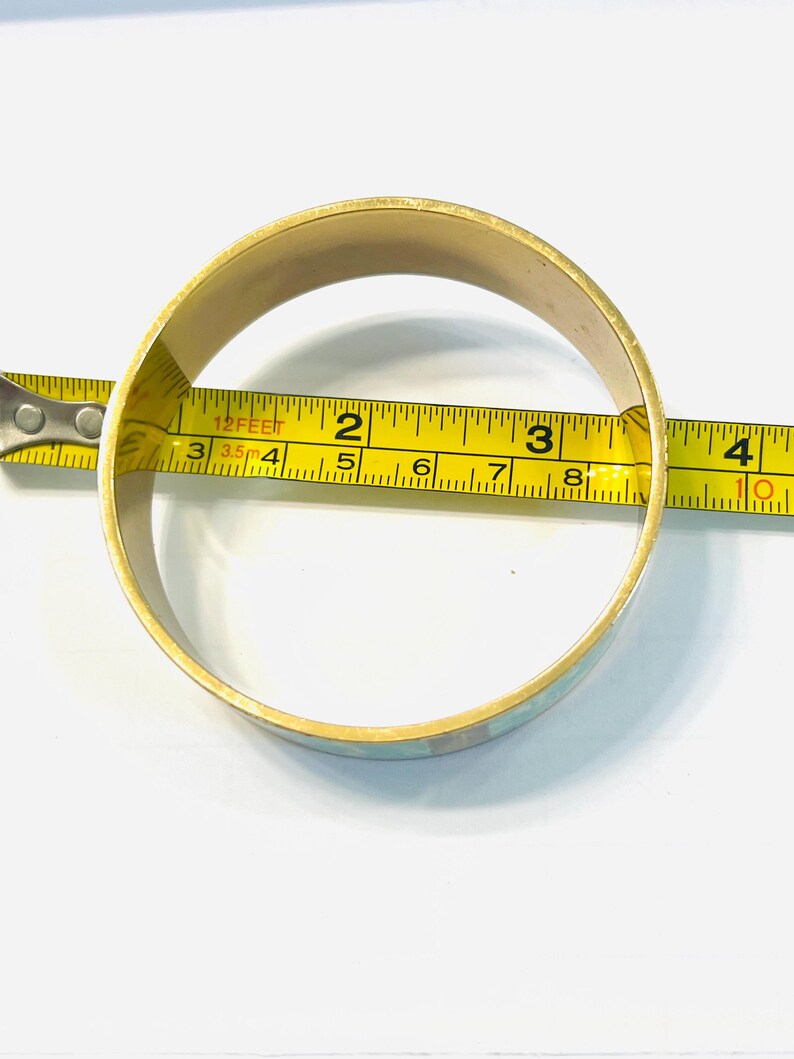 May include: A set of three ceramic mugs with a speckled, matte finish. The mugs are in shades of cream, light gray, and dark gray. Each mug has a simple, minimalist design, perfect for coffee or tea.