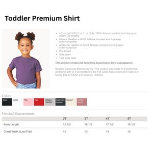 May include: A toddler premium shirt in a solid purple color with short sleeves and a crew neckline. The image includes a product specification chart listing fabric composition, manufacturing standards, available color swatches, and a size chart.