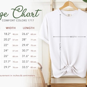 a size chart for a white t-shirt, providing measurements for different sizes such as S, M, L, XL, XXL, and 3XL. The chart includes a label for the width and length of the t-shirt, and a description of how to measure the t-shirt in inches and centimeters.