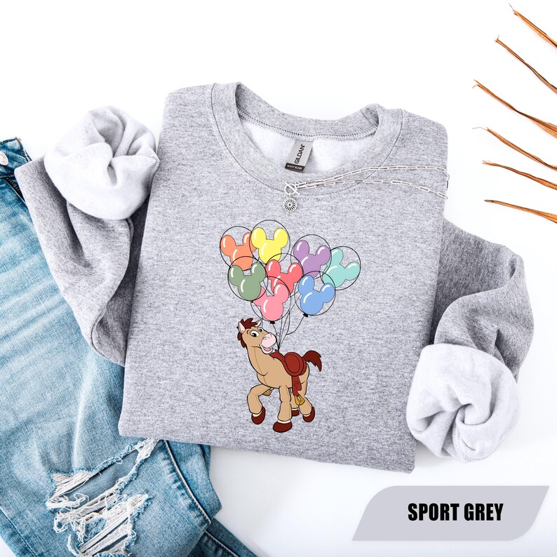 May include: A set of three ceramic mugs with a speckled, matte finish. The mugs are in shades of cream, light gray, and dark gray. Each mug has a simple, minimalist design, perfect for coffee or tea.