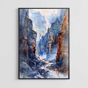 May include: Watercolour painting depicting a canyon scene with towering rock formations in shades of blue, brown, and orange. The artwork is framed in a black border, showing a river flowing through the canyon.