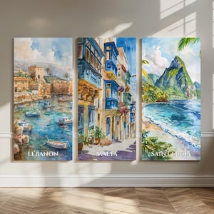 May include: A triptych of watercolor prints depicting coastal scenes. The prints feature the text "LEBANON", "MALTA", and "SAINT LUCIA". The Lebanon print shows a harbor with boats. The Malta print shows buildings with blue balconies. The Saint Lucia print shows a beach and mountain.