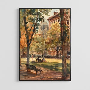 May include: A framed watercolor painting depicting an autumn city park scene with tall trees, fallen leaves, and a black metal bench in the foreground. In the background, people sit on benches near a street with parked cars and tall buildings.