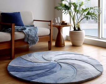 Tappeto rotondo fatto a mano – Design in lana a spirale blu con motivo astratto moderno