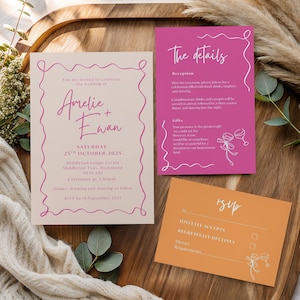 May include: Wedding invitation suite featuring three cards. The main invitation is light pink with a pink border and text. The details card is hot pink, and the RSVP card is orange. All cards have elegant script and floral illustrations.