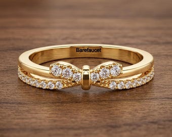 Dainty Ring Features A Unique Double Bow Design Round Cut Moissanite Diamond Band, Pave Set Bow Motif At The Center, 7k Yellow Gold