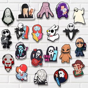 May include: A collection of colorful, cartoon-style shoe charms featuring various horror movie characters. The charms include figures like Jack Skellington, Freddy Krueger, and characters from the Scream franchise, perfect for personalizing footwear.
