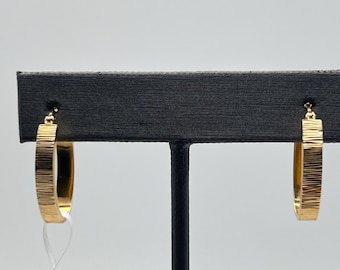 14k pair of gold textured flat oval hoop earrings (2.0 grams)