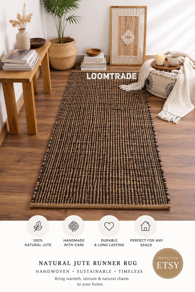 May include: A rectangular runner rug featuring a woven pattern of alternating natural tan and black jute fibers. The rug has a textured surface and a consistent weave throughout its length. The text LOOMTRADE is visible on the rug surface.