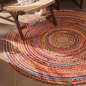 Bring warmth, texture, and sustainability into your home with this handwoven Chindi round rug, crafted by skilled Indian artisans using traditional flat-weave techniques. Made from recycled cotton rags and natural jute, this round jute rug blends rustic farmhouse charm with retro, Navajo-inspired character.Hand Braided Round Chindi And Jute Rug, Custom Size Natural Circle Jute And Chindi Rug, Living Room Decor Round Rug Entryway Circle Area Rug,chindi round rug, cotton braided rug, custom size