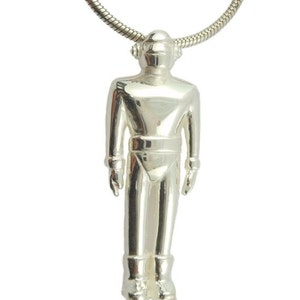 May include: A silver robot pendant necklace with a silver chain.